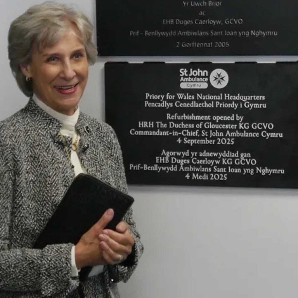 HRH The Duchess of Gloucester officially re-opens St John Ambulance Cymru’s refurbished headquarters and stands in front of the plaque.